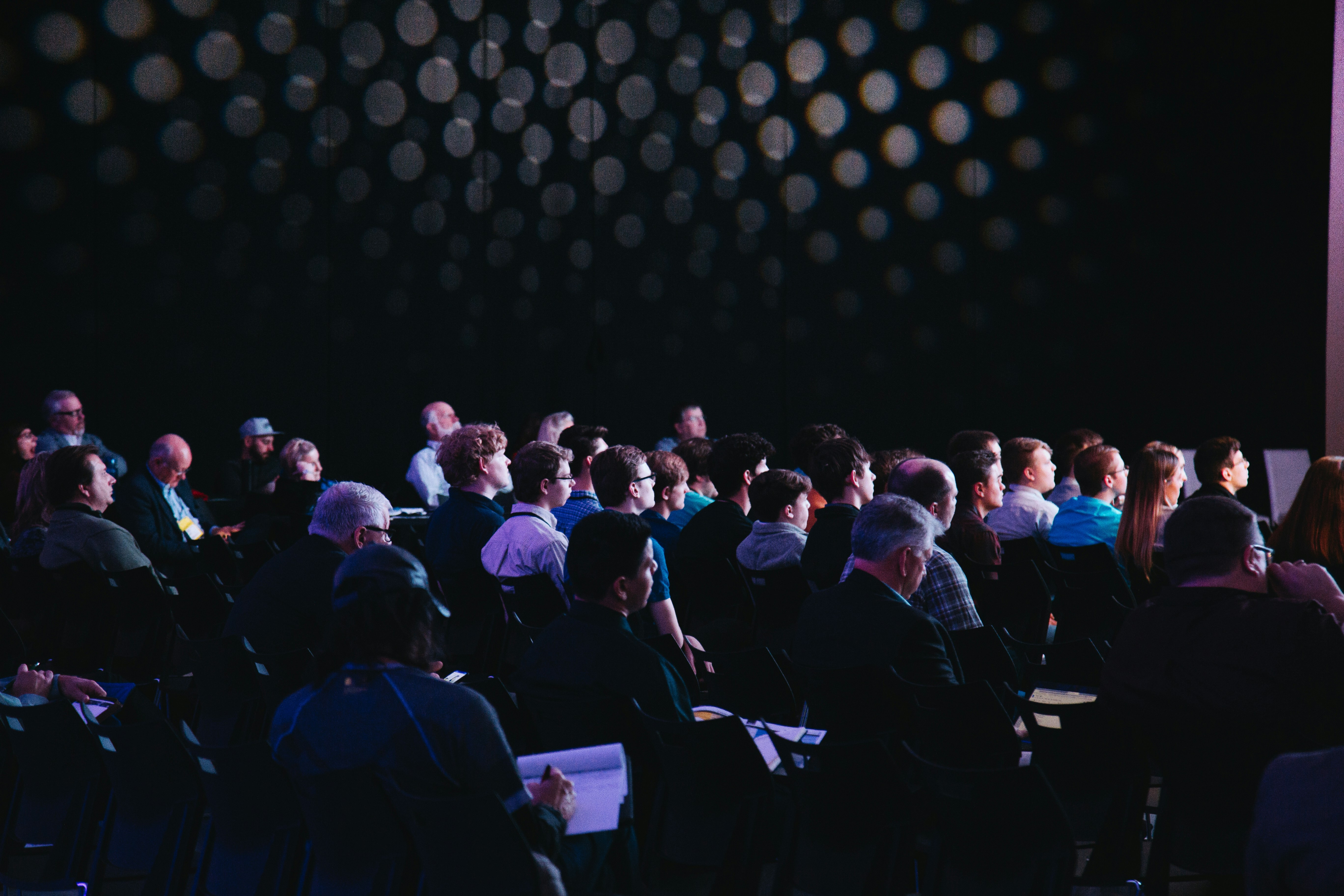 Candid shot of a motivated conference attendee taking notes during a workshop